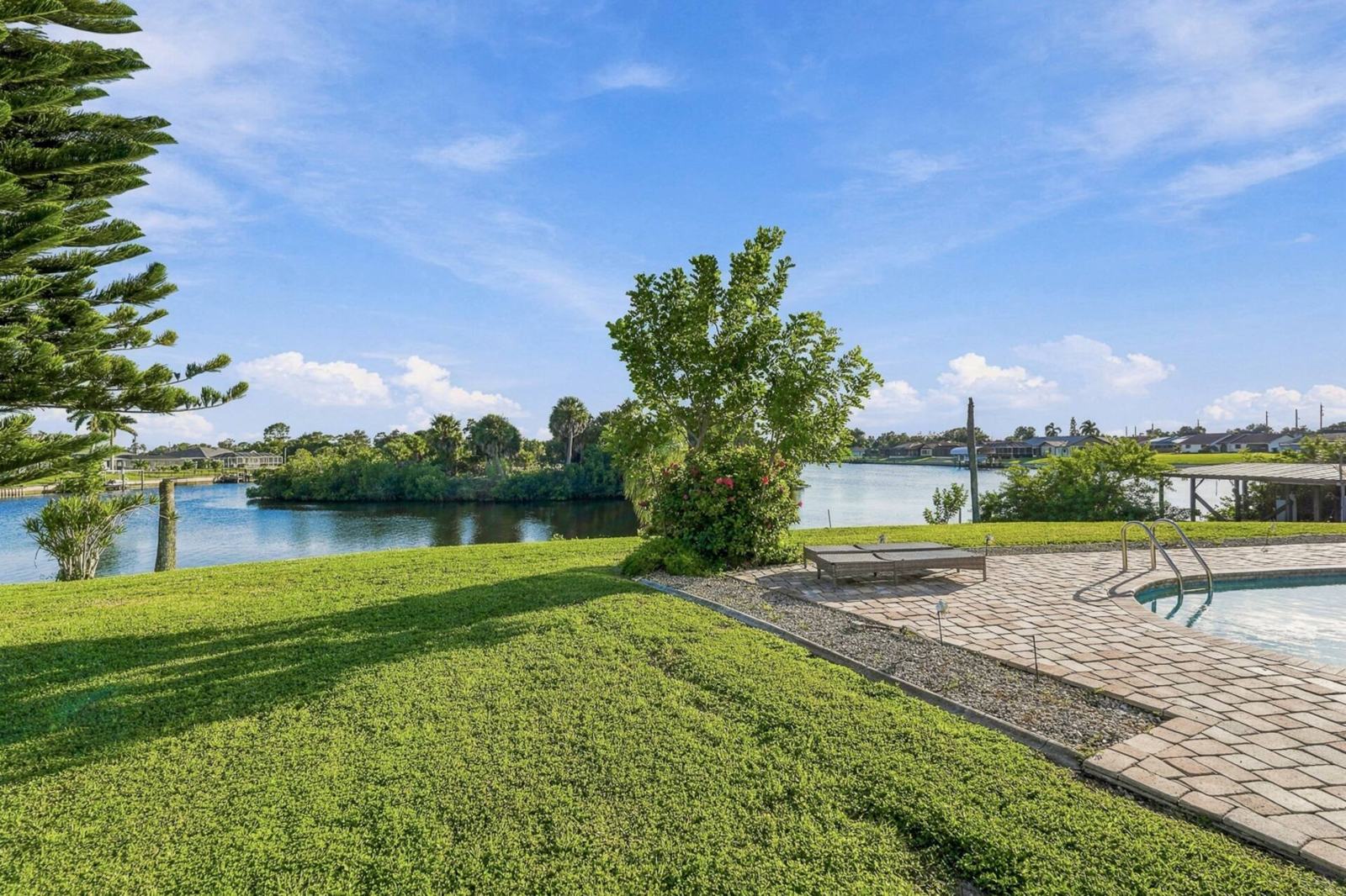 Green lawn running down to the canal